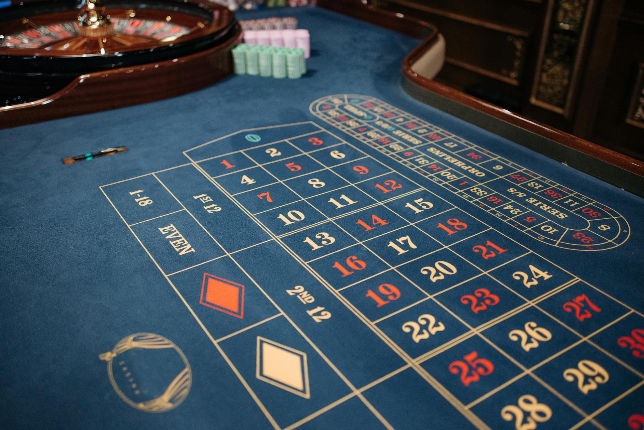 Home Luxurious casino setting with a roulette table ready for high-stakes gaming sessions.